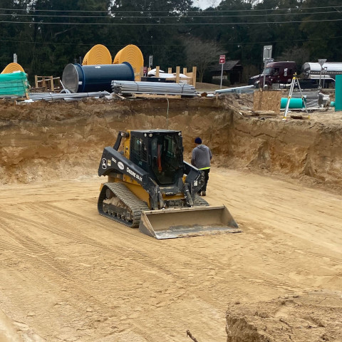 chavers construction skid steer on a commercial job site