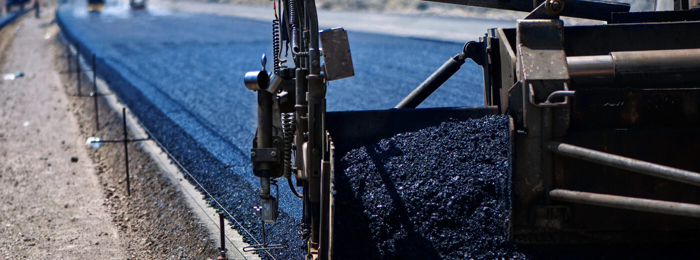 Industrial pavement truck laying fresh