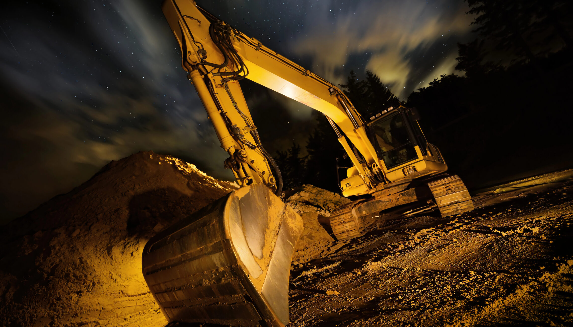 Excavator night dramatic lighting composition